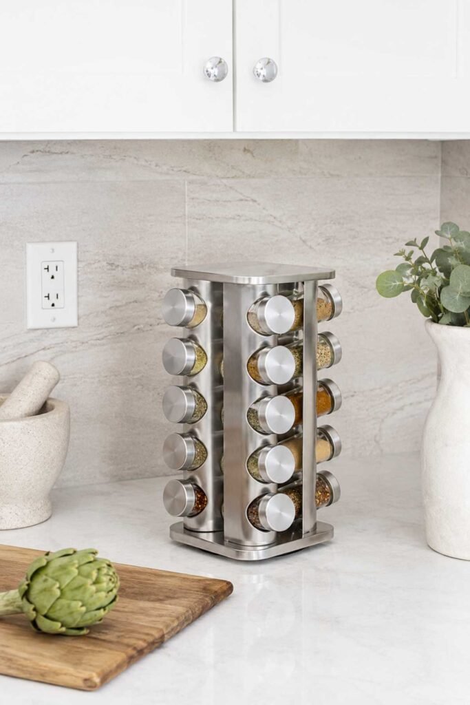 Rotating spice organizer beside stove in an organized modern kitchen