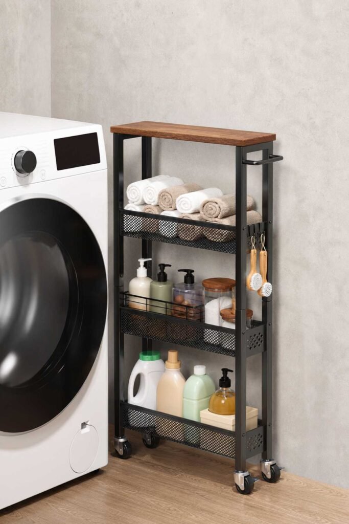 Small laundry room organization ideas with slim rolling cart between washer and dryer
